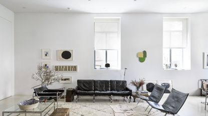 A living room with white walls