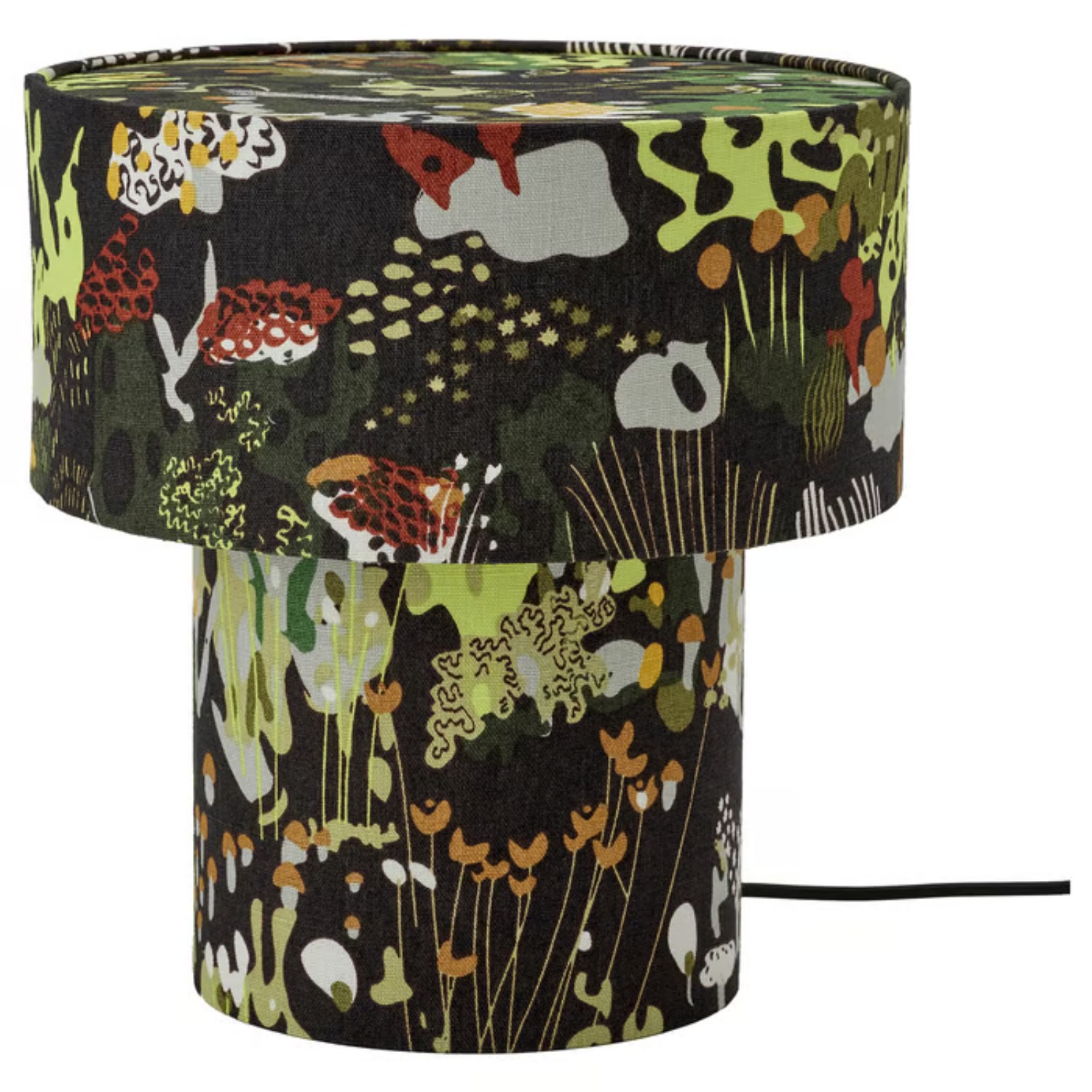 A black wired table lamp with a nature-inspired pattern