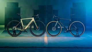 Two Wilier Rave SLR bikes - in gravel and all-road builds - face each other in a darkened warehouse