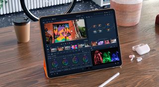 Best iPad deals — iPad tablet on woodend tablet next to Apple Pencil and AirPods Pro wireless earbuds