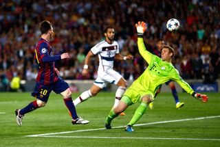 Lionel Messi chips the ball over Manuel Neuer to score for Barcelona against Bayern Munich in the 2015 Champions League semi-final first leg at Camp Nou.