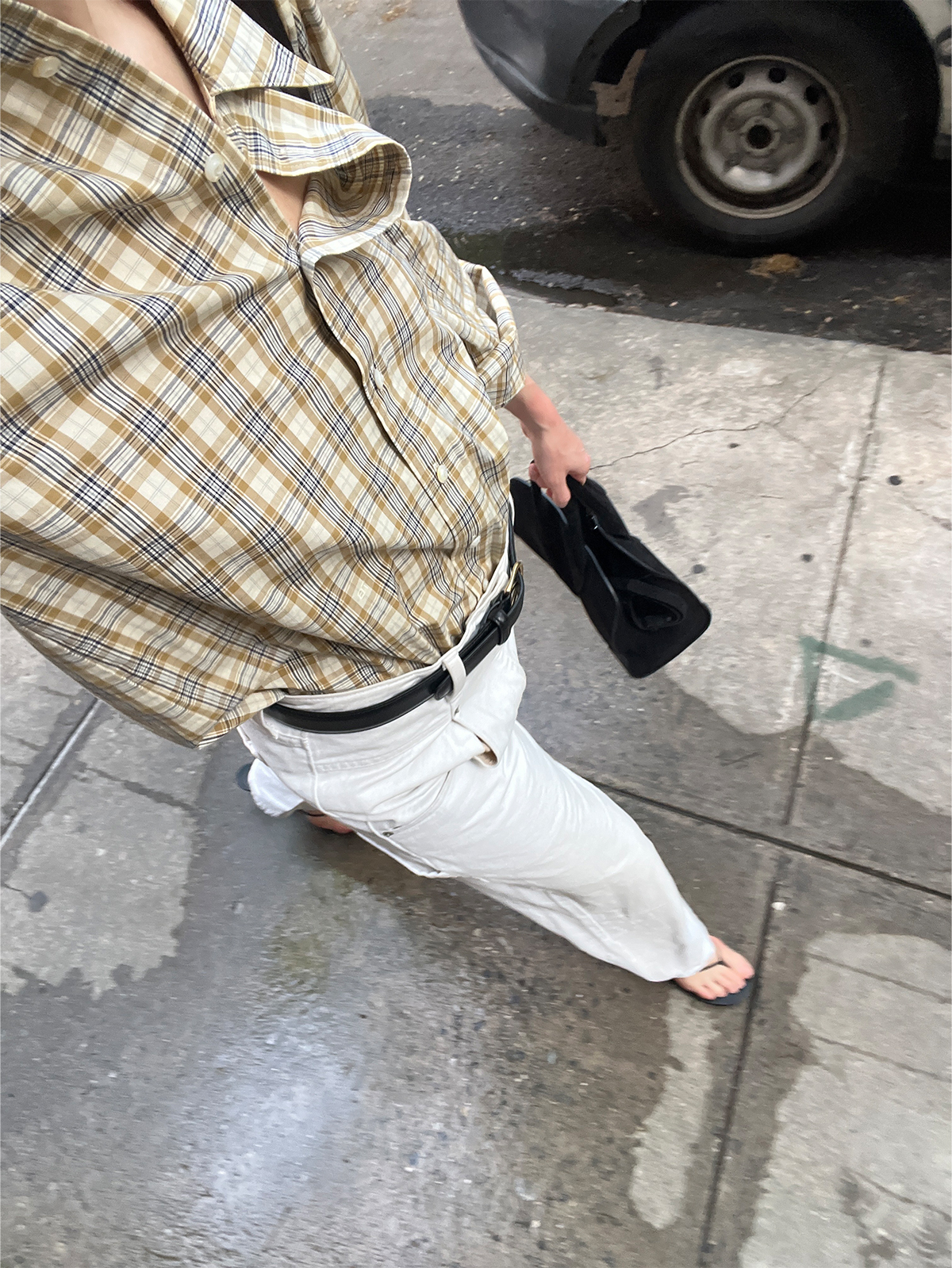 Eliza Huber in Chicago wearing a plaid Tory Burch button-down shirt with white jeans.