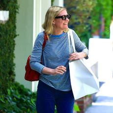 Kirsten Dunst wears white sandals while shopping on Melrose Place in West Hollywood