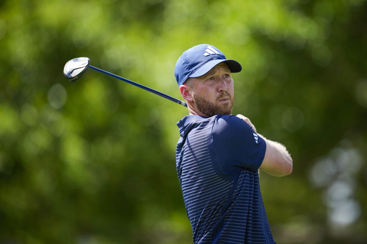 Daniel Berger hits a fairway wood