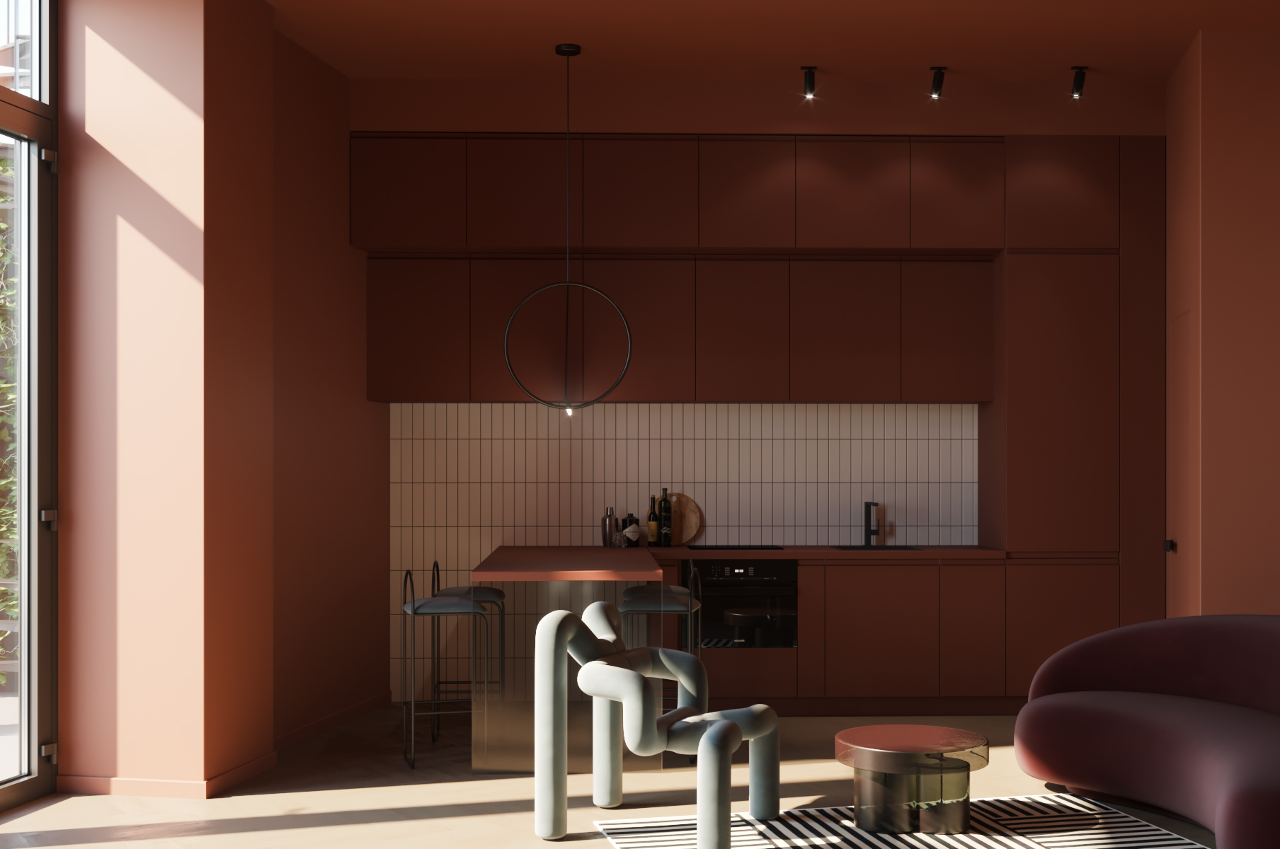 A kitchen in all red, terracotta colors, with an island extension