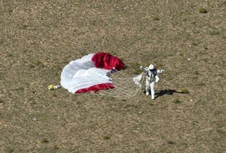 Skydiver Felix Baumgartner of Austria celebrates after successfully completing the world's highest skydive, a supersonic leap, for Red Bull Stratos in Roswell, New Mexico, on Oct. 14, 2012.