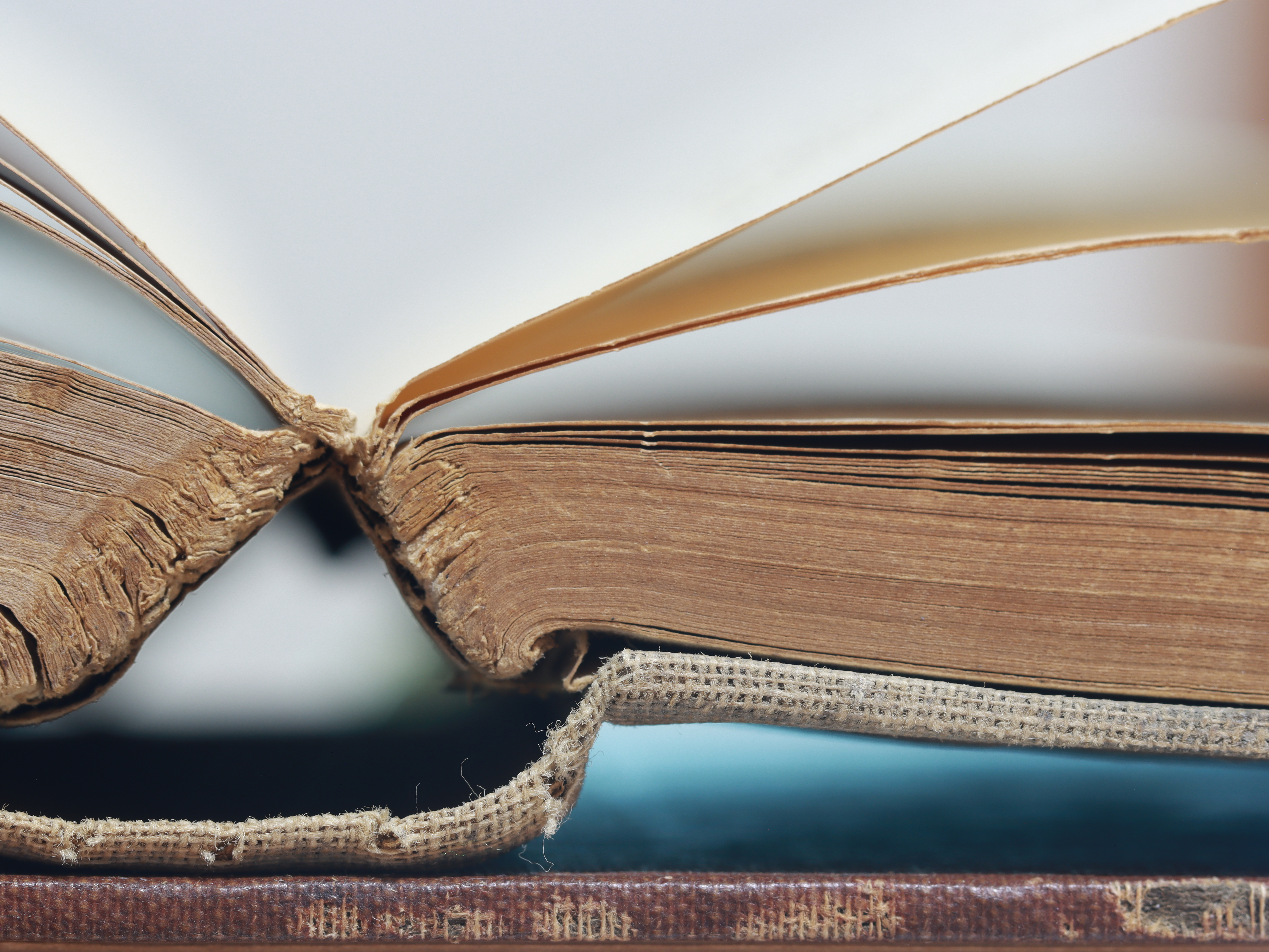 A book with its spine strained.