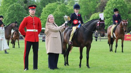 Posy Lindsay and Littmere Duplicate stand for a photo after claiming the 2026 Windsor novice show pony championship.