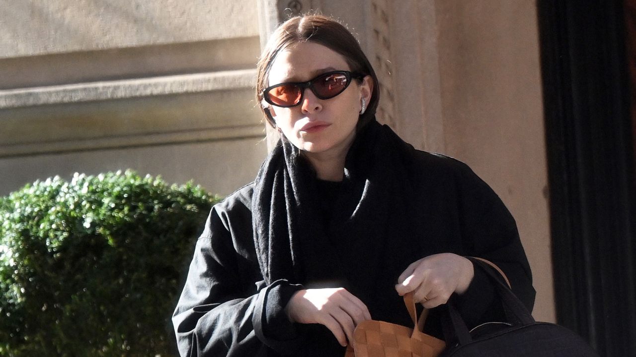 Ashley Olsen in New York City carrying the double bag trend with a pair of her The Row flip flops