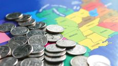 coins scattered on a map of the United States