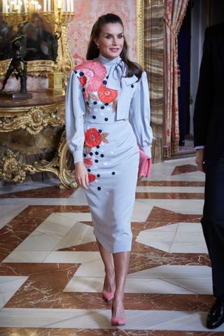 Queen Letizia wearing a statement shirt and pencil skirt