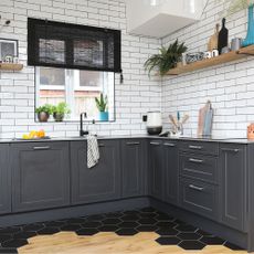 black kitchen with white tiles
