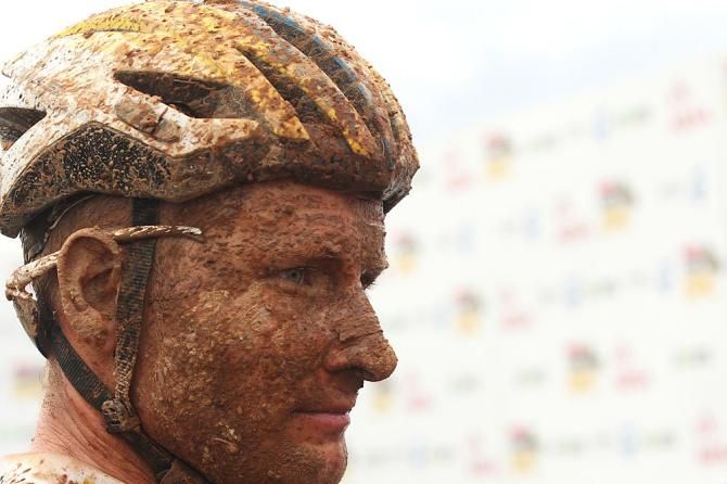 Mud encrusted Urs Huber of Team Bulls after finishing second during stage 2