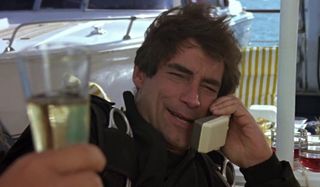 The Living Daylights Timothy Dalton being offered a glass of champagne