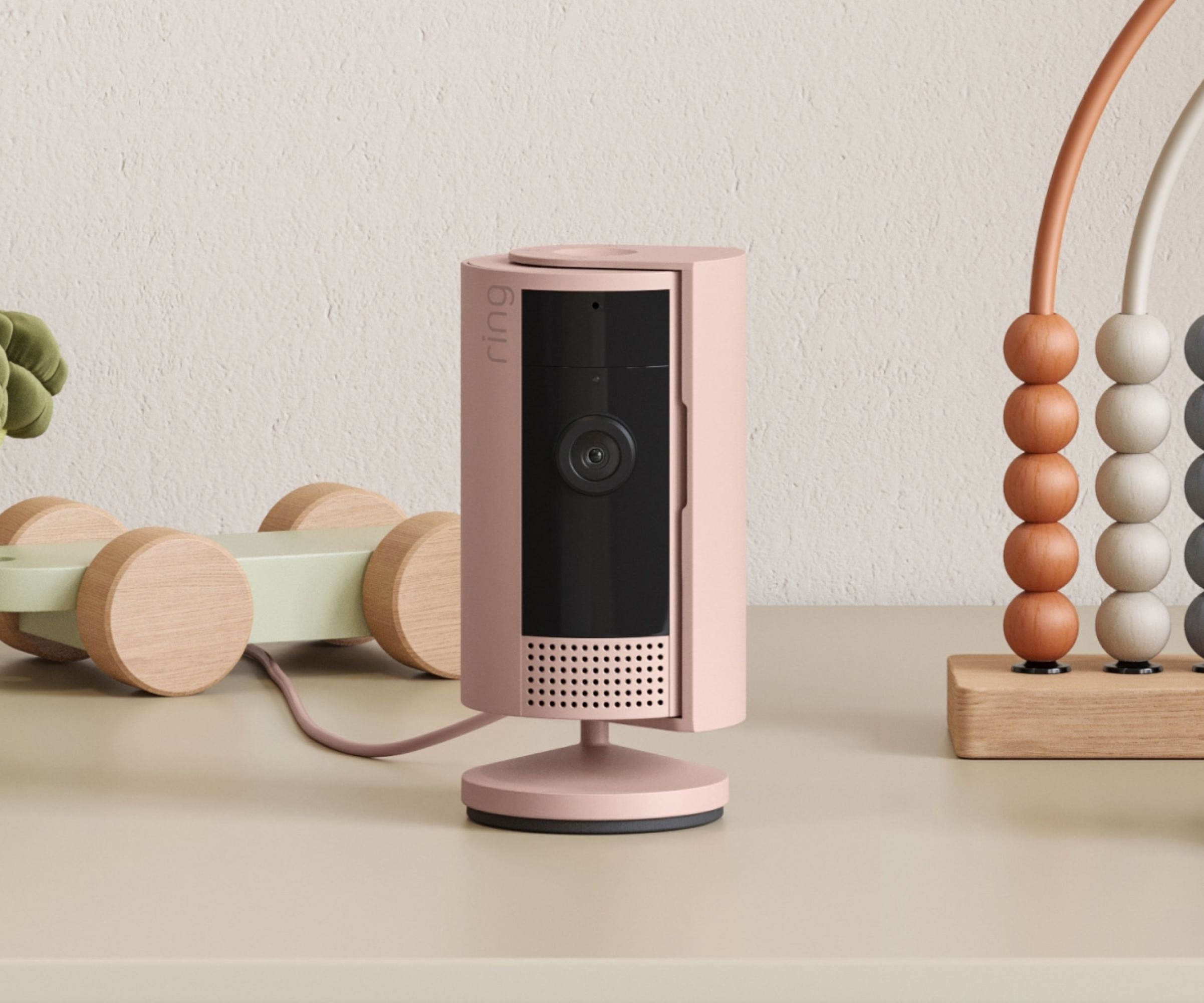 A pink security camera on a table top