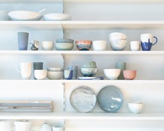 shelves feature wall with bowls and plates