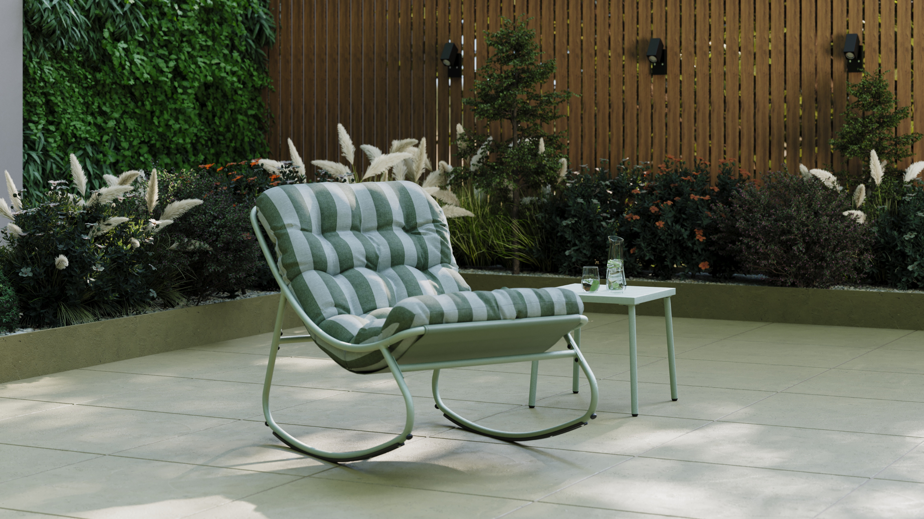 Green stripe Porto rocking chair on a shaded patio.