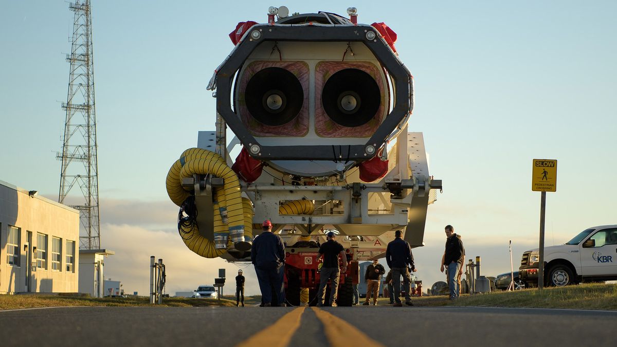 A Northrop Grumman Antares rocket is seen as it rolls out to Pad-0A, Tuesday, Oct. 29, 2019, at NASA's Wallops Flight Facility in Virginia.
