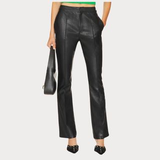 Flat lay image of woman wearing black leather trousers