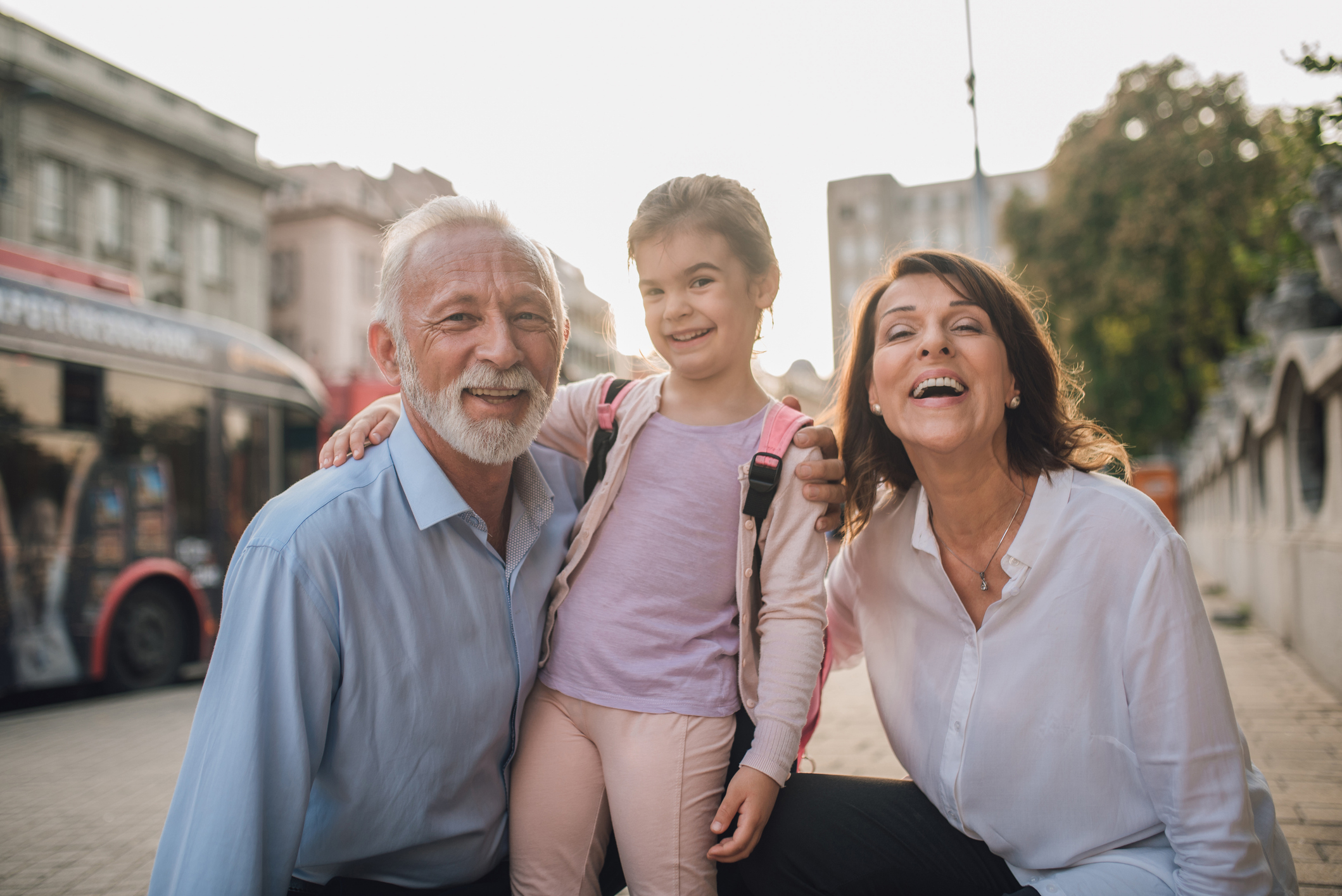 Older couple having fun with granddaughter