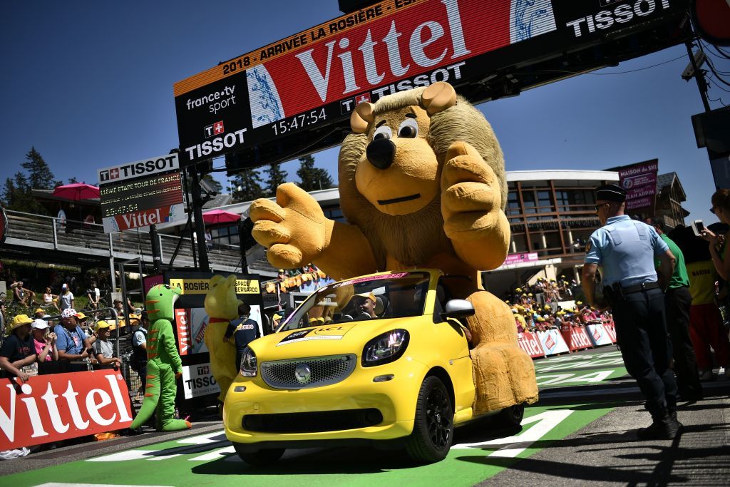 A Tour de France caravan vehicle stops at the finish line 