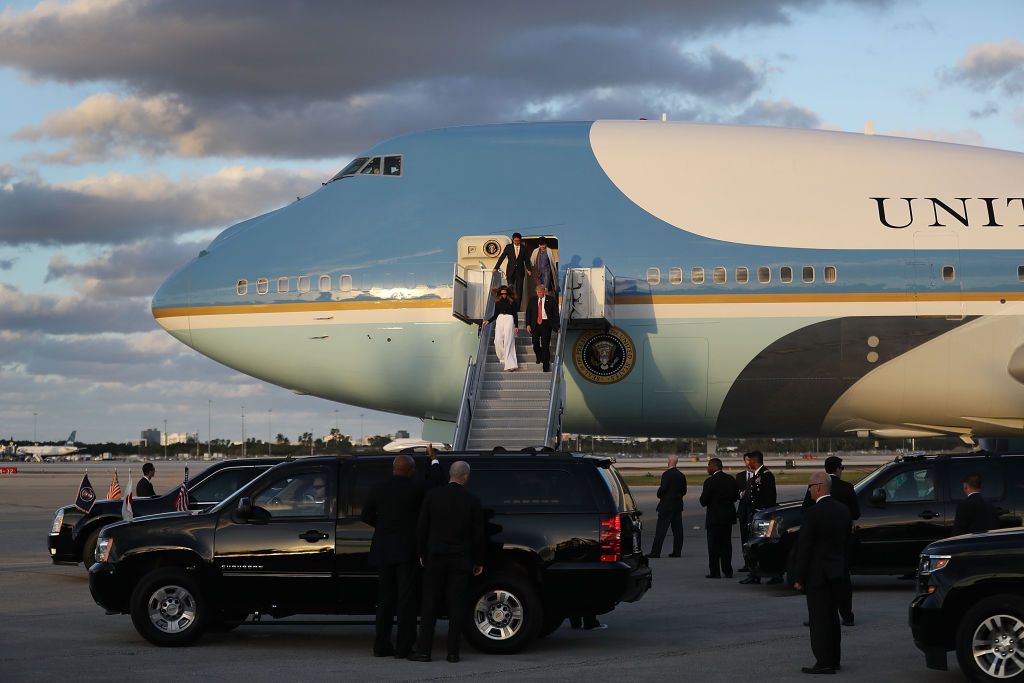  President Donald Trump and his wife Melania Trump walk down the stairs as they arrive with Japanese Prime Minister Shinzo Abe and his wife Akie Abe on Air Force One at the Palm Beach Interna