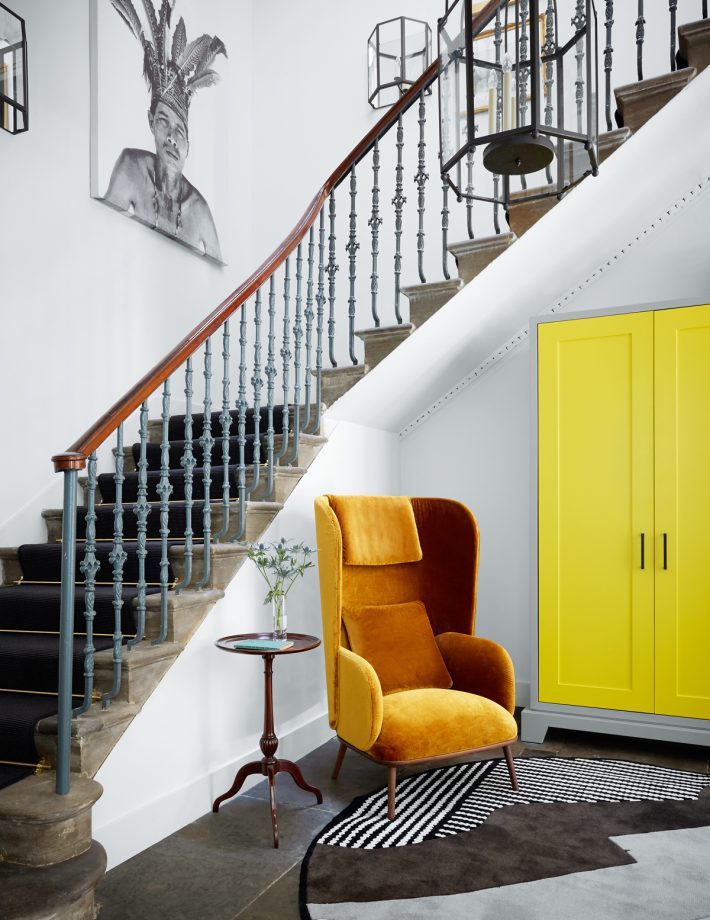 staircase with stair runner on stone steps