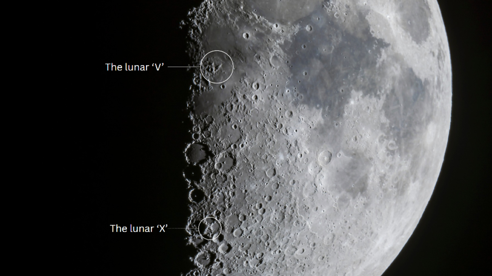 A close up of the Moon's surface, showing an X and v in the dust.