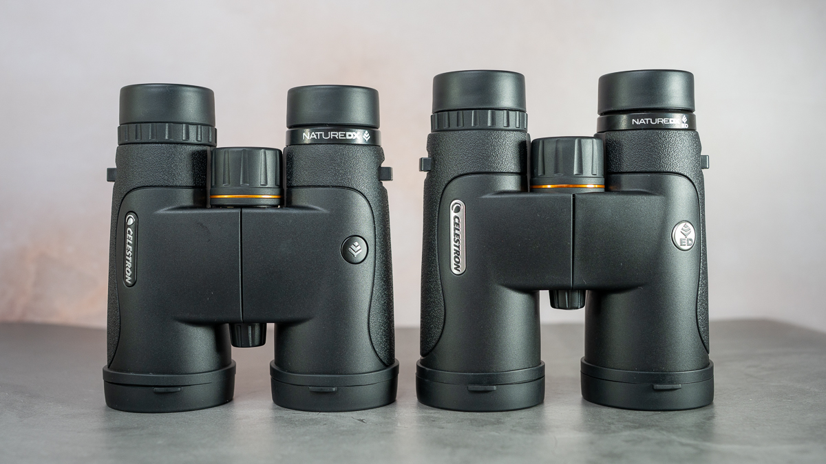 Celestron Nature DX 10x42 and Celestron Nature DX ED 10x42on a table