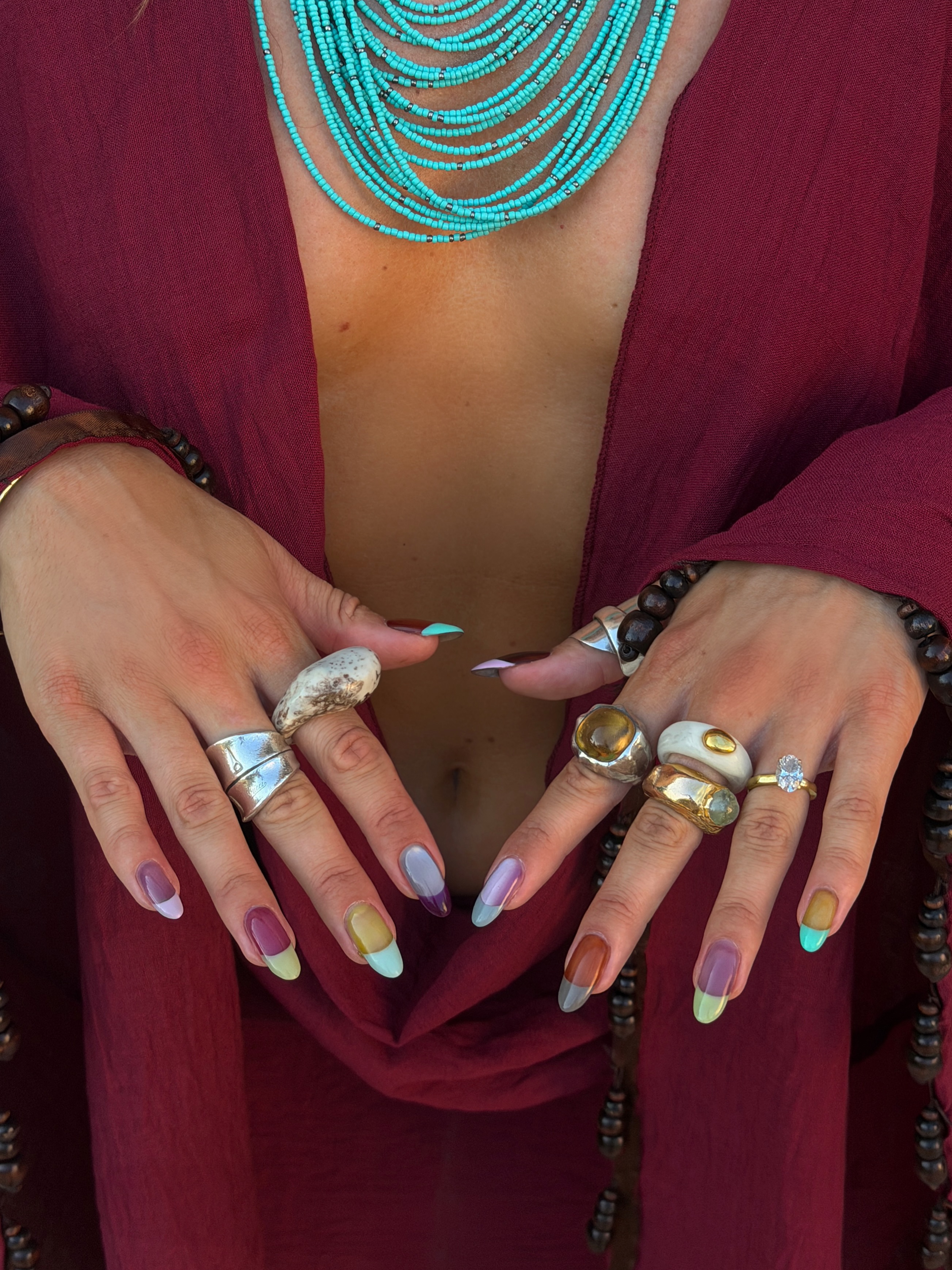 Short nails decorated with crisp, two-tone capsule shapes in contrasting colors for a graphic pillbox manicure