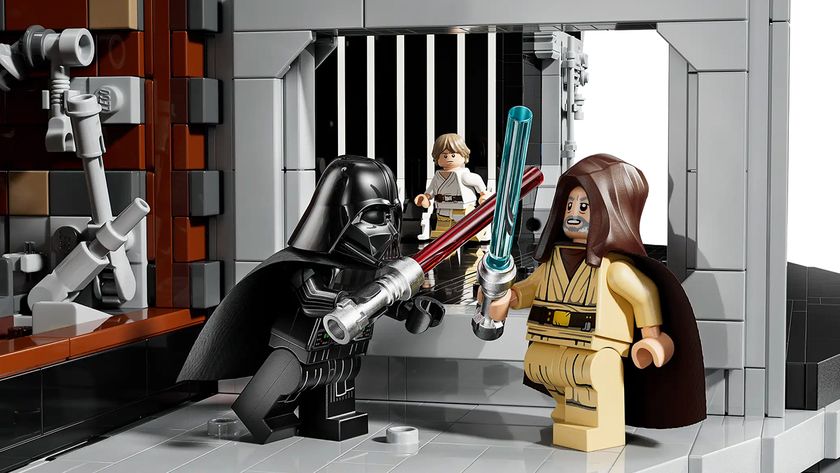 A close up of LEGO Darth Vader and LEGO Obi-Wan battling with their light sabers 