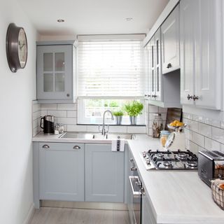 Grey and white L-shaped kitchen