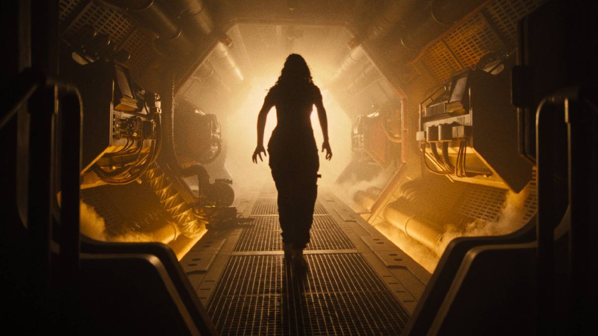 A woman walking down a yellow corridor in space during the upcoming movie, Alien Romulus.