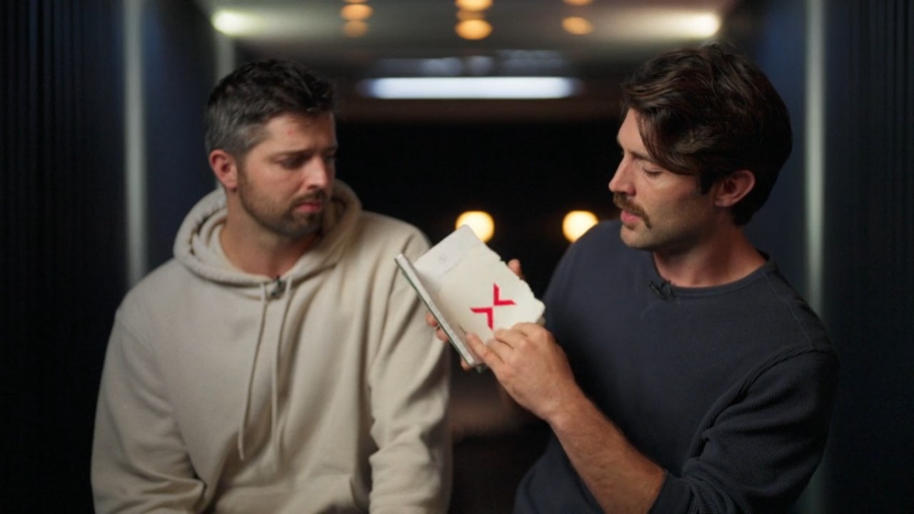 Daniel and David looking at X in boo on Extracted.