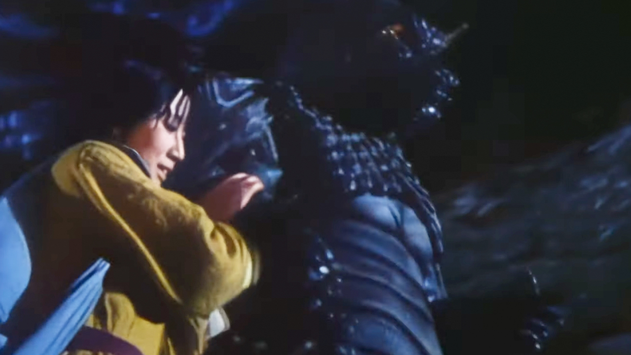A woman walking with the monster in Pulgasari