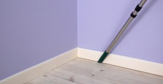 lilac painted room with white skirting boards to show how to clean skirting boards with a vacuum