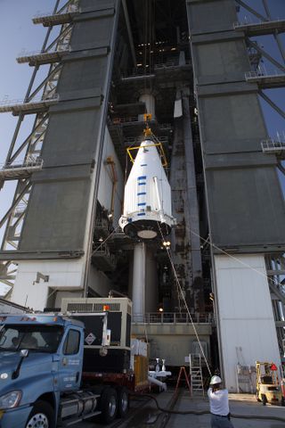 The payload fairing containing NASA's OSIRIS-REx probe being raised atop the Atlas V rocket that carried it to space.