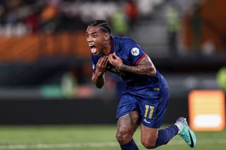 Cape Verde's forward #11 Garry Rodrigues takes off his jersey as he celebrates scoring his team's second goal during the Africa Cup of Nations (CAN) 2024 group B football match between Ghana and Cape Verde at the Felix Houphouet-Boigny Stadium in Abidjan on January 14, 2024.