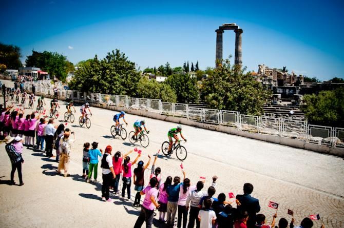 Riders passing in front of an ancient ruins in Tour of Turkey 2012