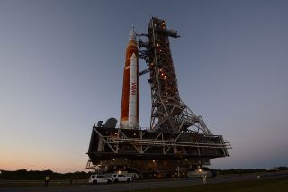 The Artemis I Space Launch System (SLS) is seen atop an Apollo-era crawler transporter and new mobile launcher on its first rollout to the launchpad on March 17, 2022.