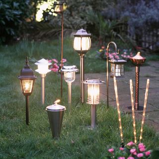 garden lawn with large and sturdy pots lanterns and lights