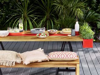 grey decking beneath modern outdoor dining scene