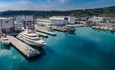 CRN's shipyard in Anoca, Italy featuring 8 yachts on varying sizes in the water. 