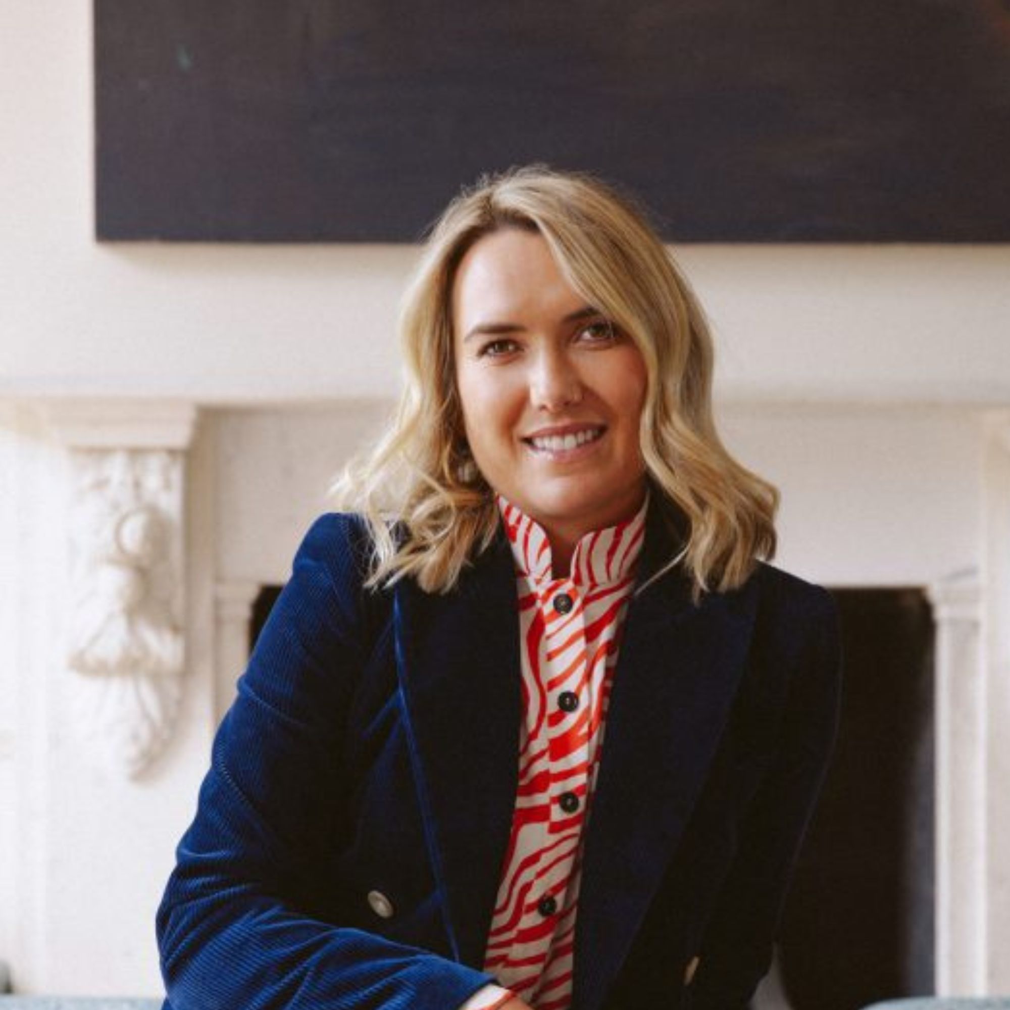 blonde woman smiling at camera