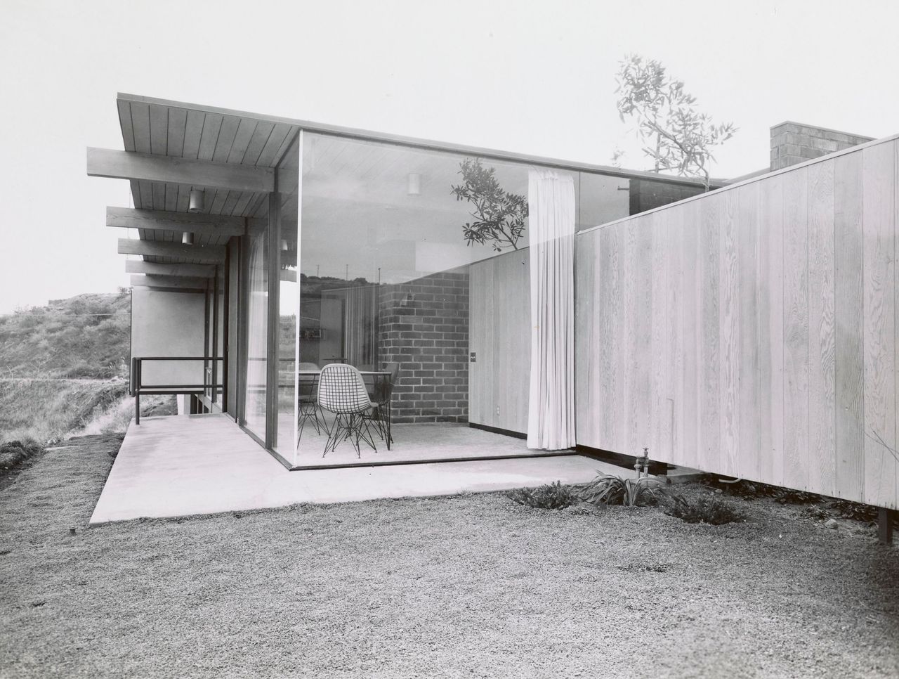 Modernist 1960s interiors of the homes in Crestwood hills. lots of glass, few walls, exposed brick