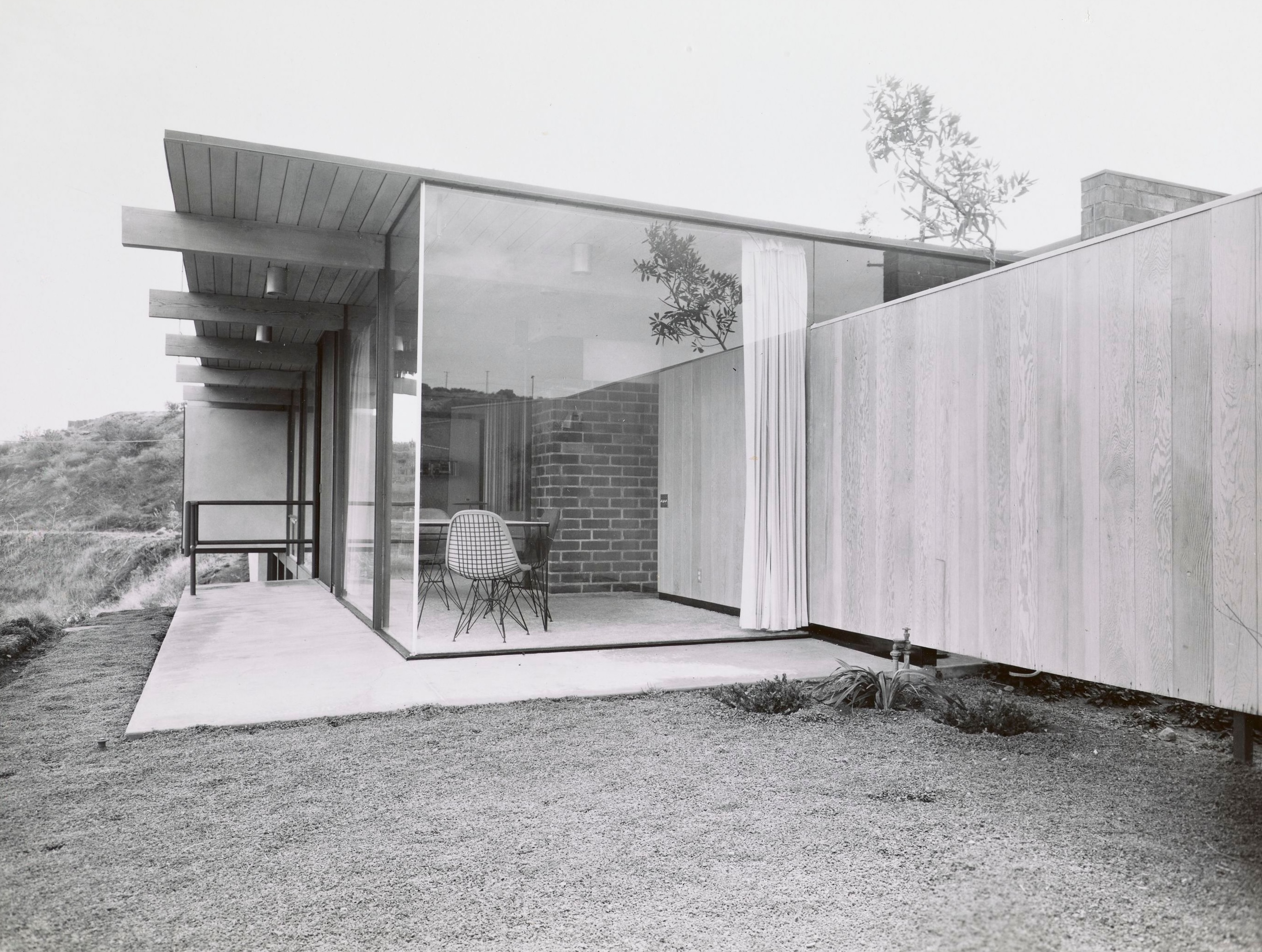 Modernist 1960s interiors of the homes in Crestwood hills. lots of glass, few walls, exposed brick