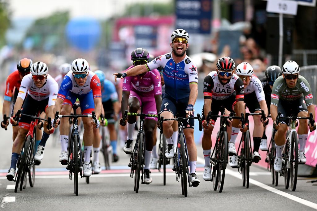 BALATONFURED HUNGARY MAY 08 Mark Cavendish of United Kingdom and Team QuickStep Alpha Vinyl celebrates winning ahead of Arnaud Demare of France and Team Groupama FDJ Hailu Biniam Girmay of Eritrea and Team Intermarch Wanty Gobert Matriaux purple points jersey Fernando Gaviria Rendon of Colombia and UAE Team Emirates and Jakub Mareczko of Italy and Team Alpecin Fenix during the 105th Giro dItalia 2022 Stage 3 a 201km stage from Kaposvr to Balatonfred Giro WorldTour on May 08 2022 in Balatonfured Hungary Photo by Stuart FranklinGetty Images