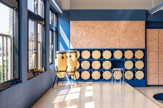 tabletops and stools stored inside a wall at a school in Taiwan