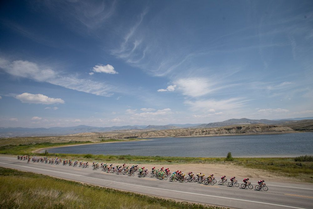 The peloton passes by a lake along the route of stage 2at the USA Pro Challenge.