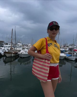 Emma Chamberlain wears red shorts.